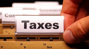 tax or taxes concept with word on business folder index; Shutterstock ID 64423618; PO: Open Forum; Job: Financial Watch; Client: Federated Media