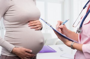 pregnant woman consultating with the doctor at hospital